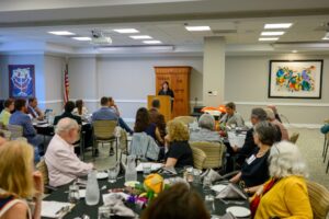 Annual Meeting 2025, Room Photo with Donna Horowitz at Podium